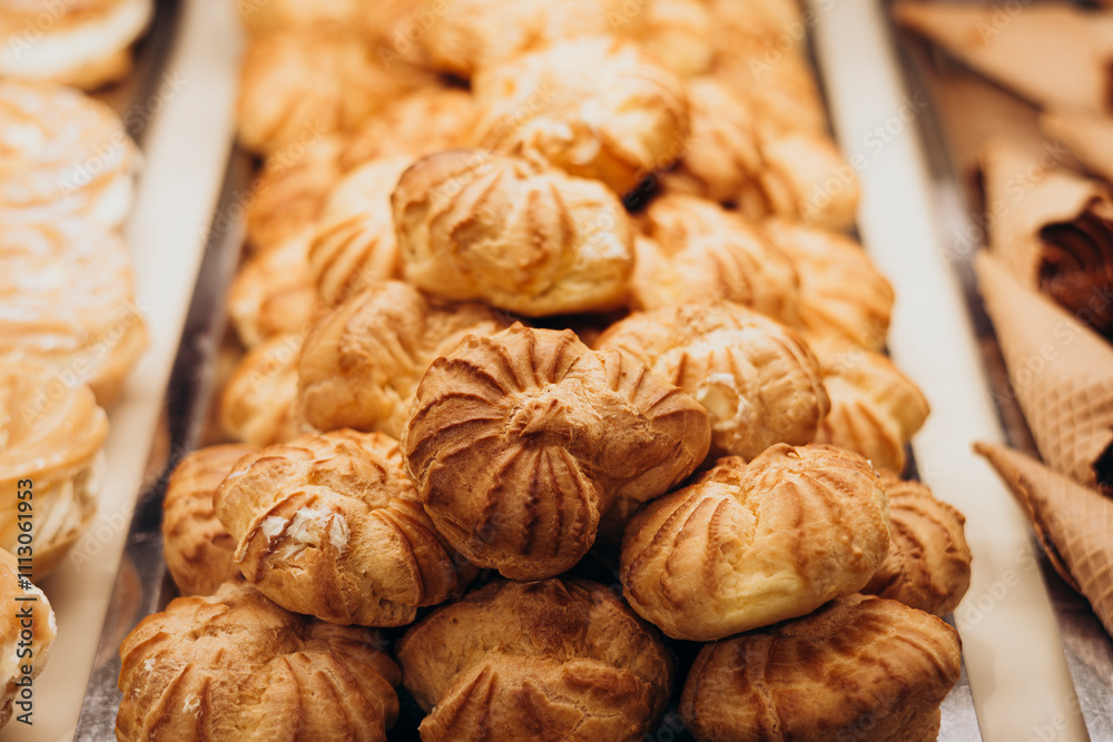Fresh pastries and desserts in a pastry shop display window Fresh pastries and desserts in a pastry shop display window