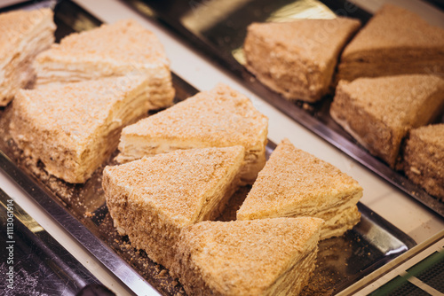 Delicious desserts displayed in a pastry shop window photo