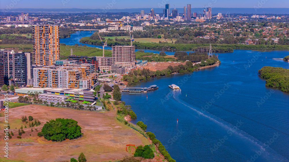 Fototapeta premium Panorama Aerial view above Rhodes with views to Meadowbank and Olympic park and Wentworth Point and Concord West with Parramatta River in Sydney NSW Australia