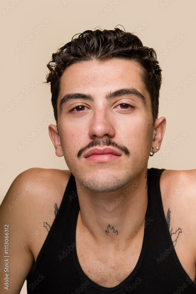 man posing on a beige background man posing on a beige background