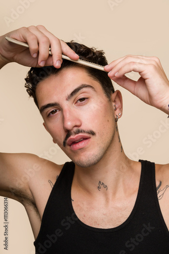 man combing his hair in a beauty routine