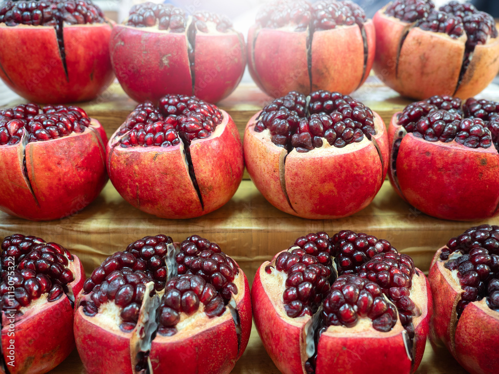 Pomegranate fruits pattern in nature background.