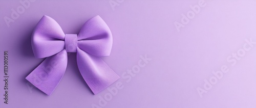 A simple lavender bow on a soft purple background, ideal for gifts or decorative purposes.