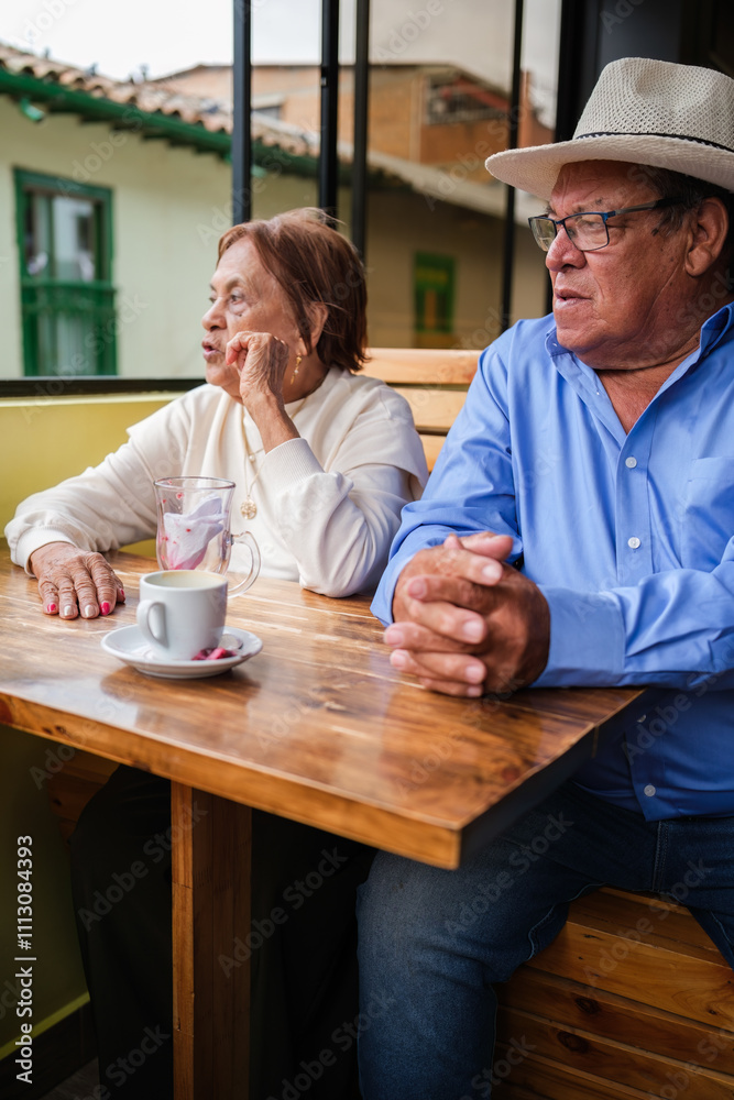 Senior Couple drinking coffee in a cafe Senior Couple drinking coffee in a cafe