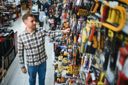 Portrait of mature man standing in hardware store