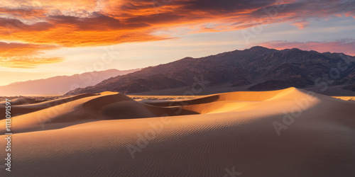 Wallpaper Mural A dramatic desert landscape at sunset with towering sandstone formations, vibrant orange and pink skies, and long shadows cast across the dunes. The majestic and serene scene evokes awe. Torontodigital.ca