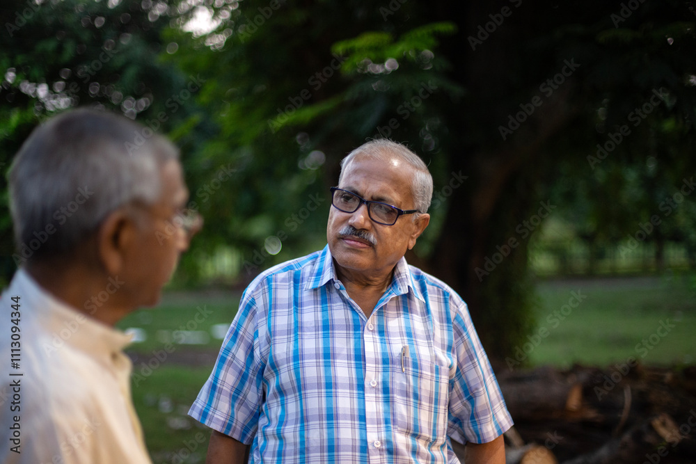 Two aged persons are speaking and making interactions 