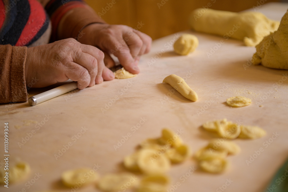 Female hans making apulian pasta orecchiette Female hans making apulian pasta orecchiette