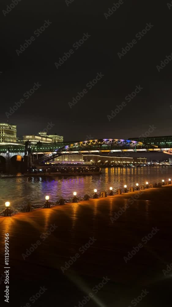 View of the embankment of the Moscow River at night. Slow motion vertical footage View of the embankment of the Moscow River at night. Slow motion vertical footage