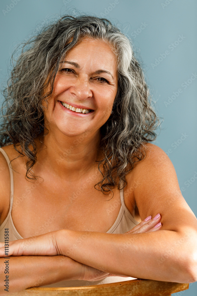 Smiling older woman with curly gray