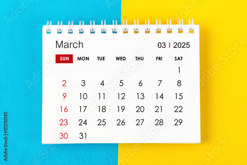 March 2025 Monthly desk calendar for 2025 year on blue and yellow. photo