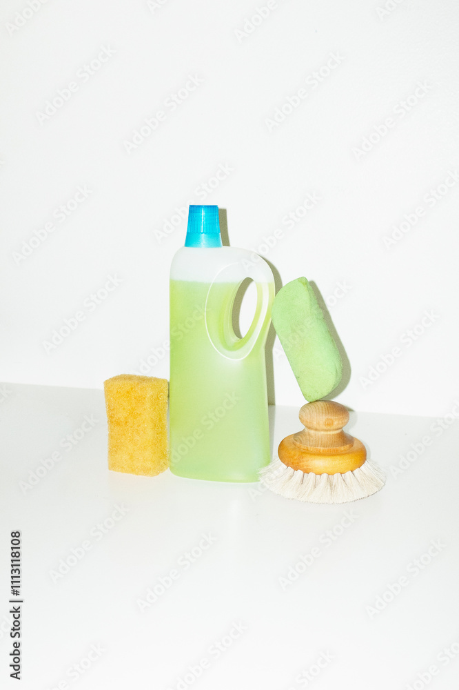 Green cleaning liquid detergent, brush and sponges with flash