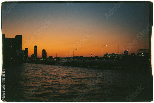 Film shot of a bridge over Hudson River in New York during dawn photo