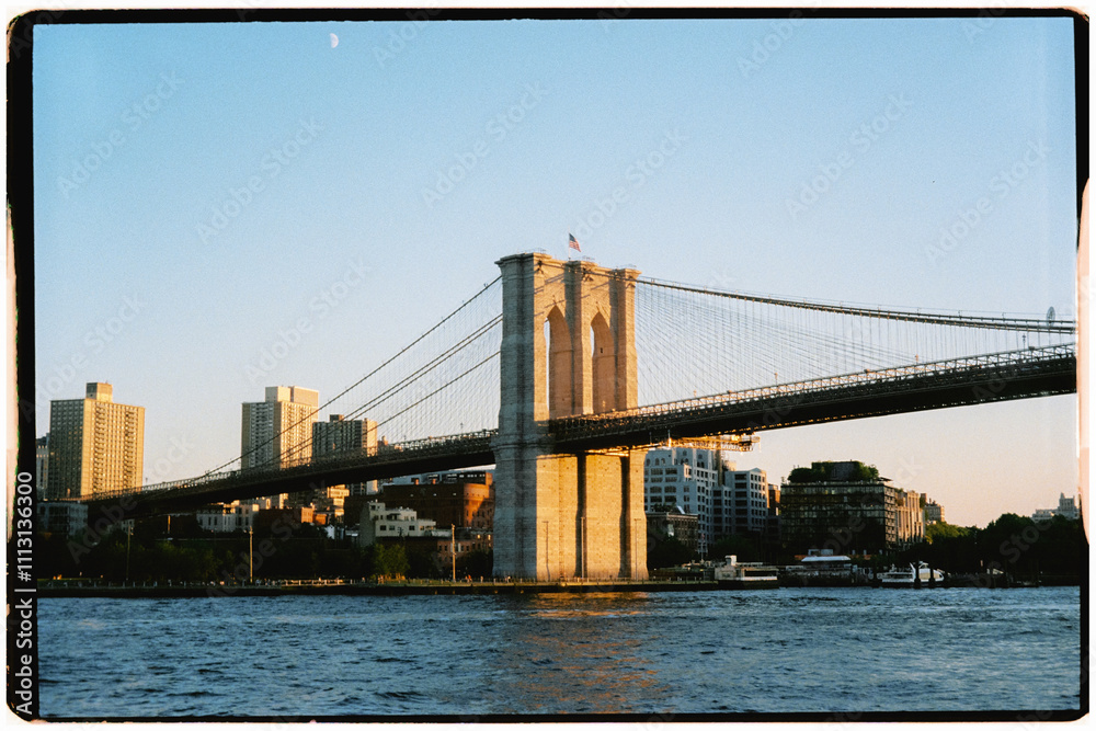 Analog shot of the Brooklyn Bridge stretching across the Hudson River Analog shot of the Brooklyn Bridge stretching across the Hudson River