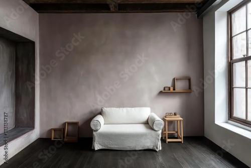 Modern loft with grayish-pink walls, dark oak floors, a minimalist white sofa, and small wooden frames for decor. photo