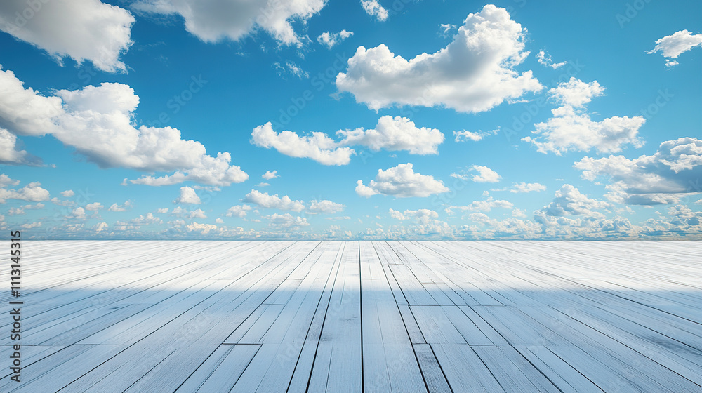 A wide shot of an empty white wooden floor with a blue sky and clouds in the background A wide shot of an empty white wooden floor with a blue sky and clouds in the background