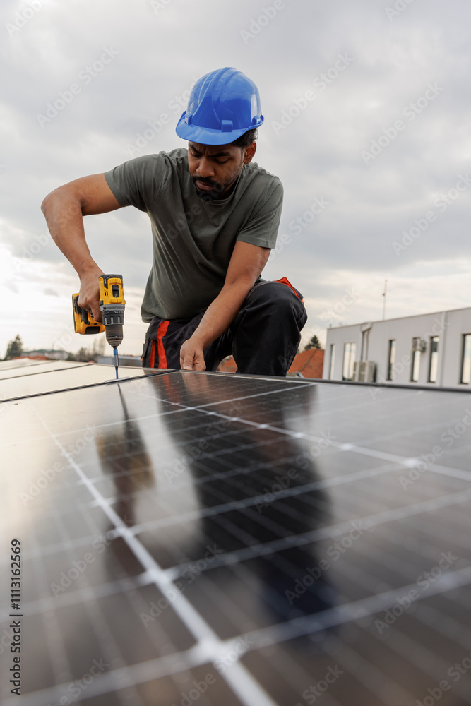 Technician installing solar panels on rooftop Technician installing solar panels on rooftop