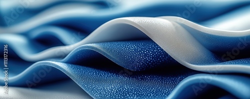 Closeup view of smooth, spongy neoprene fabric in vibrant blue, white. Waves, folds showcase fabric texture, water droplets. Modern design, tech applications evident. Suitable for sporty equipment