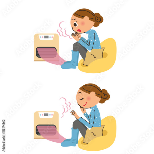 寒い部屋で暖をとってい暖まる女性