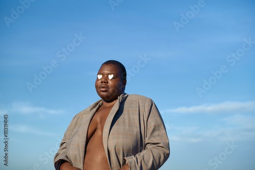 Man stands confidently on the beach photo