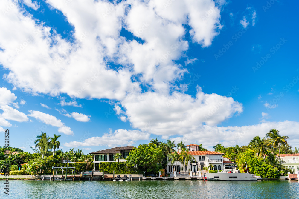 Obraz premium Vacation building in summer. Luxury waterfront house. Hotel building architecture. Private yacht dock. Modern building. Residential apartment in waterfront city. City waterfront with house