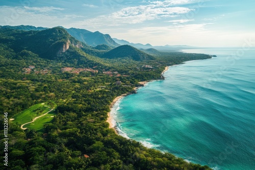 Wallpaper Mural Aerial view of tropical coastline with lush green mountains and turquoise ocean. Torontodigital.ca