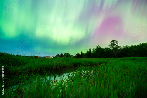 Northern Lights Shower Over Stream photo