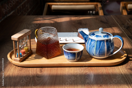 Elegant Tea Set with Chocolate Cake on Wooden Tray