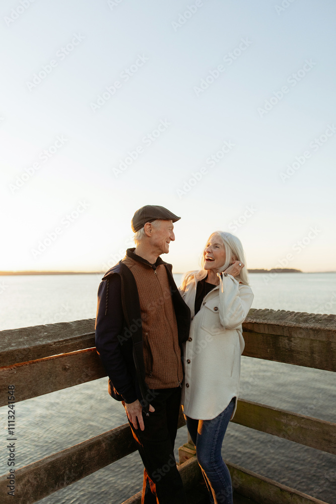 Senior Couple Enjoying a Scenic Waterfront View Senior Couple Enjoying a Scenic Waterfront View