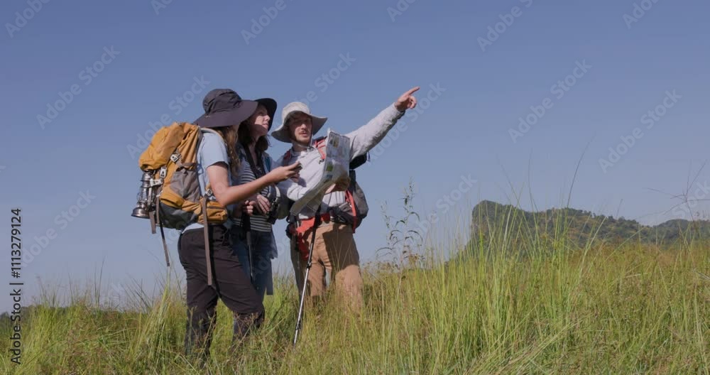 family traveler trekking looking down at map and use binoculars to explore the route. 4k video
family traveler trekking looking down at map and use binoculars to explore the route. 4k video