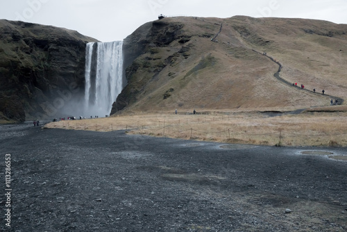 Photography skogafoss waterfall, path leading to the lookout, view of the waterfall, iceland