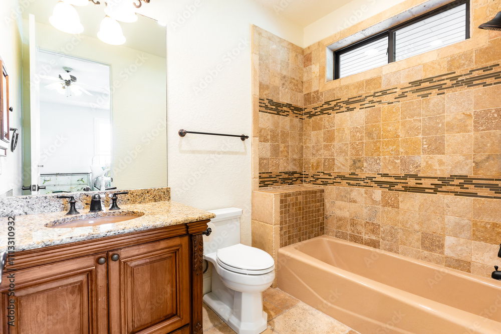 Elegant bathroom with natural stone tiles and modern fixtures in a serene space Elegant bathroom with natural stone tiles and modern fixtures in a serene space