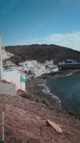 Camera moving forward revealing a coastal village on Gran Canaria