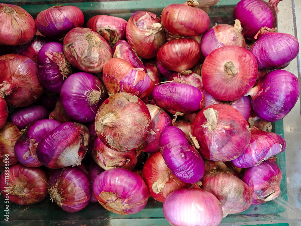 Freshly Harvested Red Onions Piled in a Market Basket Freshly Harvested Red Onions Piled in a Market Basket