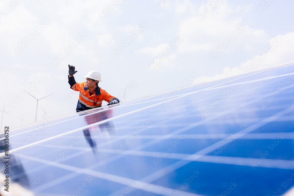 Engineer checking the activity of solar panels Engineer checking the activity of solar panels