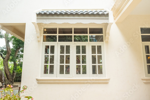 Cozy house exterior with wooden casement window and white wall rendering,Large estate home building Window Frame,minimal home concept.