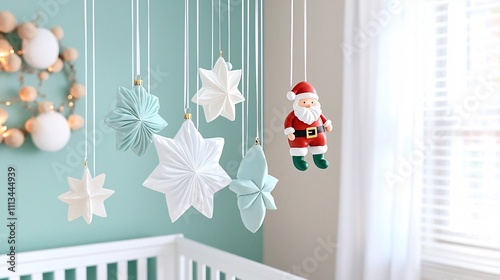 Christmas nursery decor concept. Festive decorations for a cozy nursery, featuring stars and a Santa figure against a soft blue backdrop.