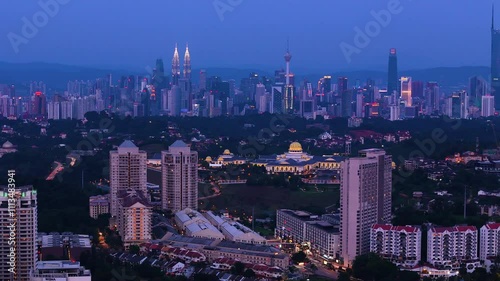 Stunning view of Mont Kiara at twilight, Kuala Lumpur. Aerial pan left photo