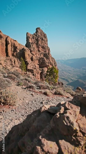 Camera moving forward showing roque nublo mountain on Gran Canaria, Spain.