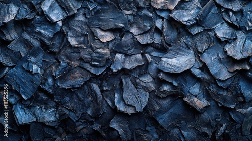 Close-up of dark slate texture with irregular patterns and rich blue tones