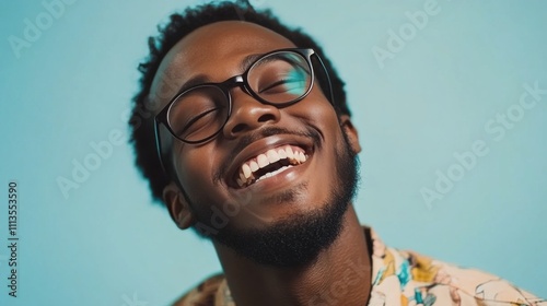 Smiling man in glasses enjoys sunny day with clear blue sky background