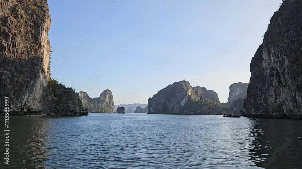 POV boat moving on Ha Long bay, Vietnam in sunset. Limestone rock islands, boat, water, sea concept. POV boat moving on Ha Long bay, Vietnam in sunset. Limestone rock islands, boat, water, sea concept.