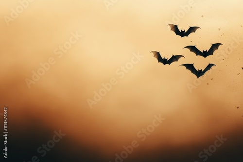 Bats flying against a sunset colored sky in the evening twilight hours