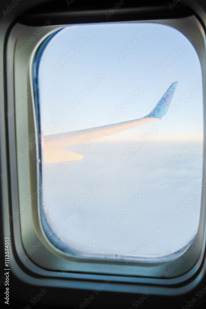 A view of an airplane wing from the inside of a plane A view of an airplane wing from the inside of a plane