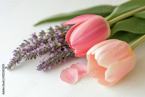 Beautiful arrangement of pink tulips and lavender on a light textured surface