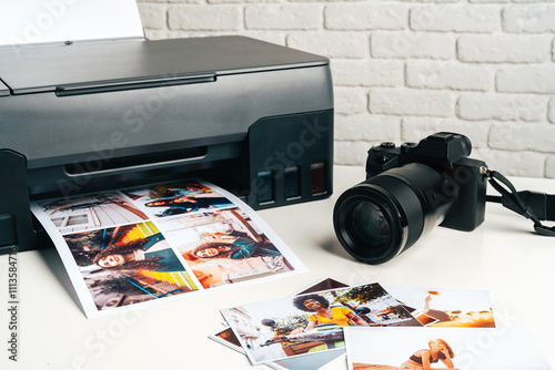 Printer and photo camera on table. Printing photos concept