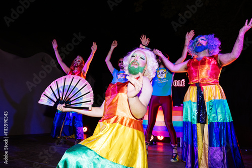 Fotografie Drag Queens Perform in Vibrant Pride-Themed Costumes at a Lively Event Celebrati