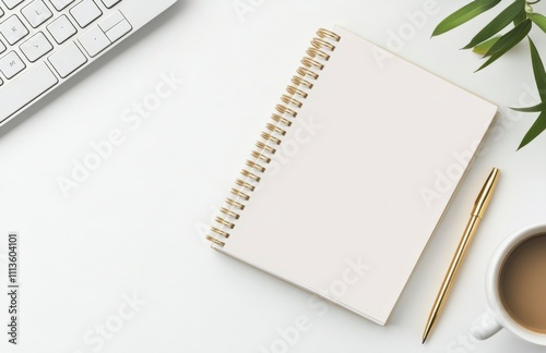 Workspace setup featuring a notepad, coffee cup, and keyboard for creative tasks