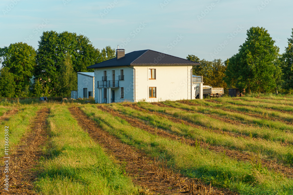 A farmhouse in a field. The owner of an agro-industrial complex. The concept of agricultural business development. A farmhouse in a field. The owner of an agro-industrial complex. The concept of agricultural business development.