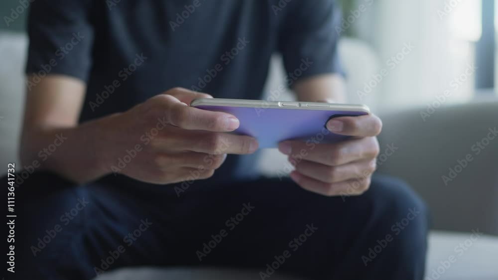 Man hold smartphone mobile addict spending time playing game on mobile phone